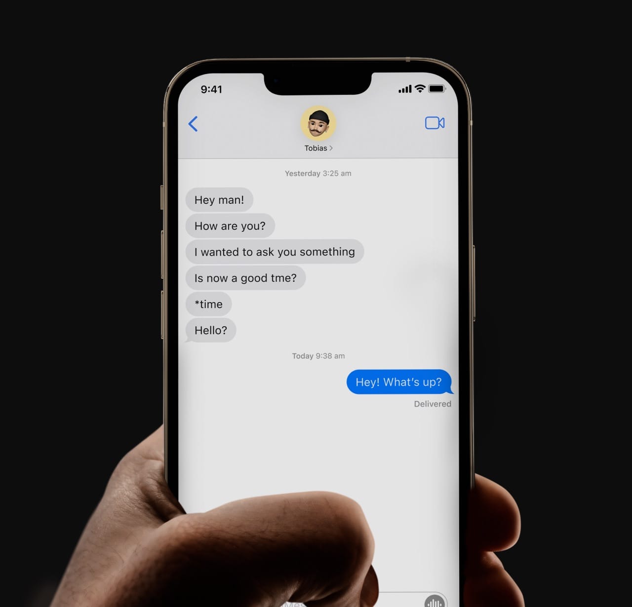 Close-up shot of an iPhone showing an iMessage chat