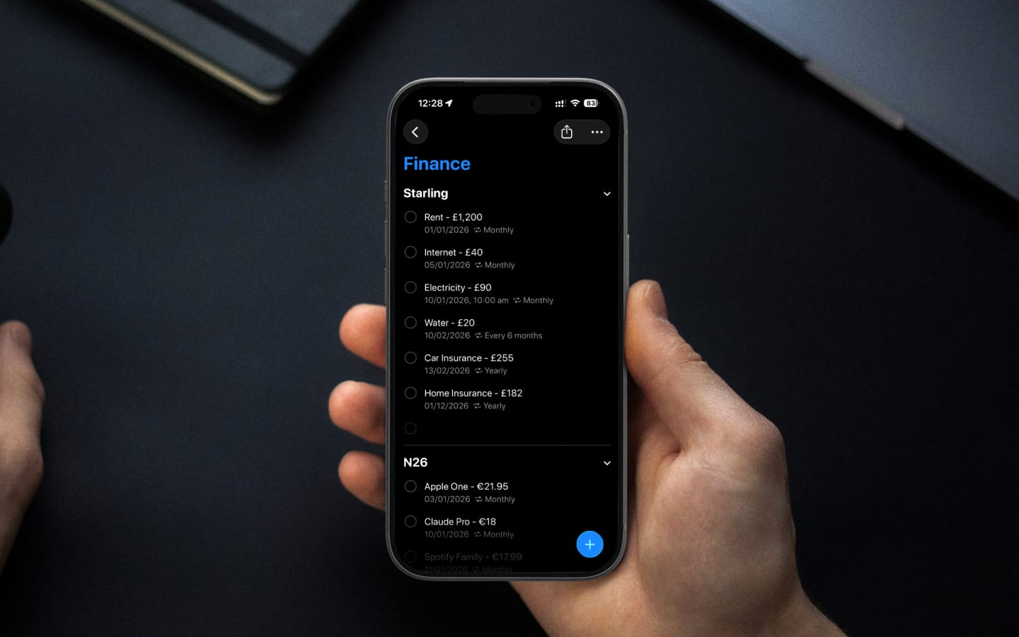 iPhone showing Reminders Finance list with bills organized by account